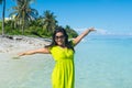 Portrait close up of young beautiful asian girl standing on the beach and rising hands up Royalty Free Stock Photo