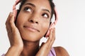 Portrait closeup of african american pleased woman using headphones Royalty Free Stock Photo