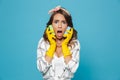 Portrait closeup of disappointed outraged housewife 20s in yellow rubber gloves for hands protection holding two sponges during c