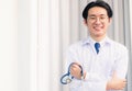 Portrait doctor man smiling crossed arm hold stethoscope Royalty Free Stock Photo