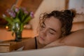 Portrait closeup of naked woman with closed eyes relaxing and spending weekend at home, blurred background. Taking bath Royalty Free Stock Photo