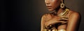 Portrait Closeup Beauty fantasy african woman, face in gold paint. Golden shiny black skin. Fashion model girl mixed