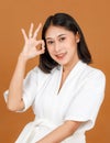 Portrait closeup studio shot of millennial Asian black short hair female model wearing makeup in white shower rope standing Royalty Free Stock Photo