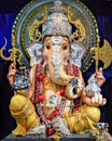 Portrait , closeup view of decorated and garlanded idol of Hindu God Ganesha