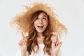 Portrait closeup of young pretty woman 20s wearing big straw hat Royalty Free Stock Photo