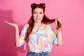 Portrait of clueless confused woman wear print shirt hold foxy hair think to cut curl shrug shoulders isolated on pink Royalty Free Stock Photo