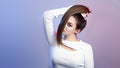 Portrait of cocky teenager girl with long ponytail hair on studio background, young woman with character, fashion model, female