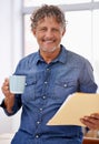 Portrait, coffee and business man with paperwork in office with pride for career, job or occupation. Entrepreneur