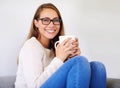 Portrait, coffee and smile of woman in home enjoying caffeine, espresso or cappuccino in living room. Happiness, tea and