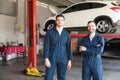 Colleagues Wearing Uniforms While Standing Together In Garage