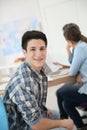 Portrait of college boy sitting in class Royalty Free Stock Photo