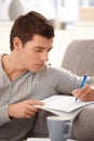 Portrait of college guy taking notes Royalty Free Stock Photo