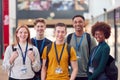 Portrait Of College Student Friends Meeting In Busy Communal Campus Building