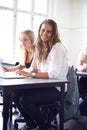 Portrait, college student and learning with laptop in class, lecture or people in education. University, classroom and