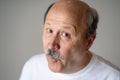 Portrait of comic and crazy senior man with funny face Royalty Free Stock Photo