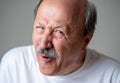 Portrait of comic and crazy senior man with funny face Royalty Free Stock Photo
