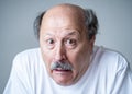 Portrait of comic and crazy senior man with funny face Royalty Free Stock Photo