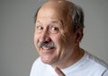 Portrait of comic and crazy senior man with funny face Royalty Free Stock Photo