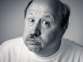 Portrait of comic and crazy senior man with funny face Royalty Free Stock Photo