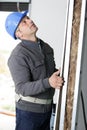 Portrait competent carpenter checking wood Royalty Free Stock Photo