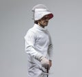 Portrait of a concentrated fencer with a sword