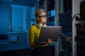Portrait of concentrated woman coder solving problem in data center Royalty Free Stock Photo