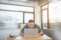 Undistracted male looking at notebook computer Royalty Free Stock Photo