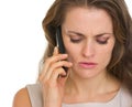 Portrait of concerned woman talking mobile phone Royalty Free Stock Photo