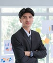 Portrait of Confidence Asian Business man Standing in front of a presenting board