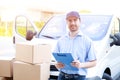 Portrait of confidence express courier and delivery van Royalty Free Stock Photo