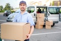 Portrait of confidence express courier and delivery van Royalty Free Stock Photo