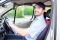 Portrait of confidence express courier on his delivery van Royalty Free Stock Photo