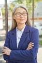 Portrait of confidence and success. Beautiful mature business woman wearing eyeglasses, looking aside and thinking about Royalty Free Stock Photo