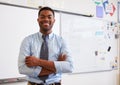 Portrait of confident African American male teacher in class Royalty Free Stock Photo