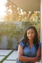 Portrait Of Confident African American Woman In Garden At Home Against Flaring Sun Royalty Free Stock Photo