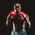 Portrait of confident african boxer standing in ready pose Royalty Free Stock Photo