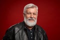 Portrait of confident aged man in black leather jacket