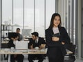 confident young asian business woman holding tablet and smile in office Royalty Free Stock Photo