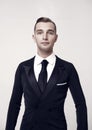 Portrait of Confident attractive handsome ballroom dancer. young man in tuxedo isolated on grey background Royalty Free Stock Photo