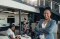 Portrait of a confident black African businesswoman smiling with her arms crossed Royalty Free Stock Photo