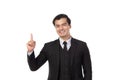 Portrait of a confident business man in black suit smile and pointing to copy space isolated on white background. Portrait Royalty Free Stock Photo