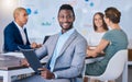 Portrait of a confident business man leading a meeting in a modern office, smiling and empowered. Happy black male Royalty Free Stock Photo