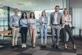 Confident business people standing together in the office Royalty Free Stock Photo