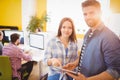 Portrait of confident business people using tablet computer at creative office Royalty Free Stock Photo