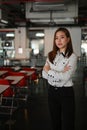 Portrait of confident business woman is standing in meeting room with her arms crossed. Royalty Free Stock Photo