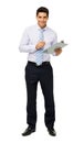 Portrait Of Confident Businessman Holding Clipboard And Pen Royalty Free Stock Photo