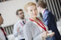 Portrait of confident businesswoman holding coffee cup at lobby in convention center Royalty Free Stock Photo