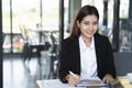 Portrait of a confident businesswoman smiling and looking at camera at meeting room, business concept Royalty Free Stock Photo