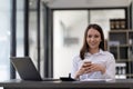 Portrait confident businesswoman working on laptop at her workplace at modern office. Royalty Free Stock Photo