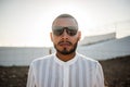 Portrait of a confident and casual man, modern muslim wearing sunglasses